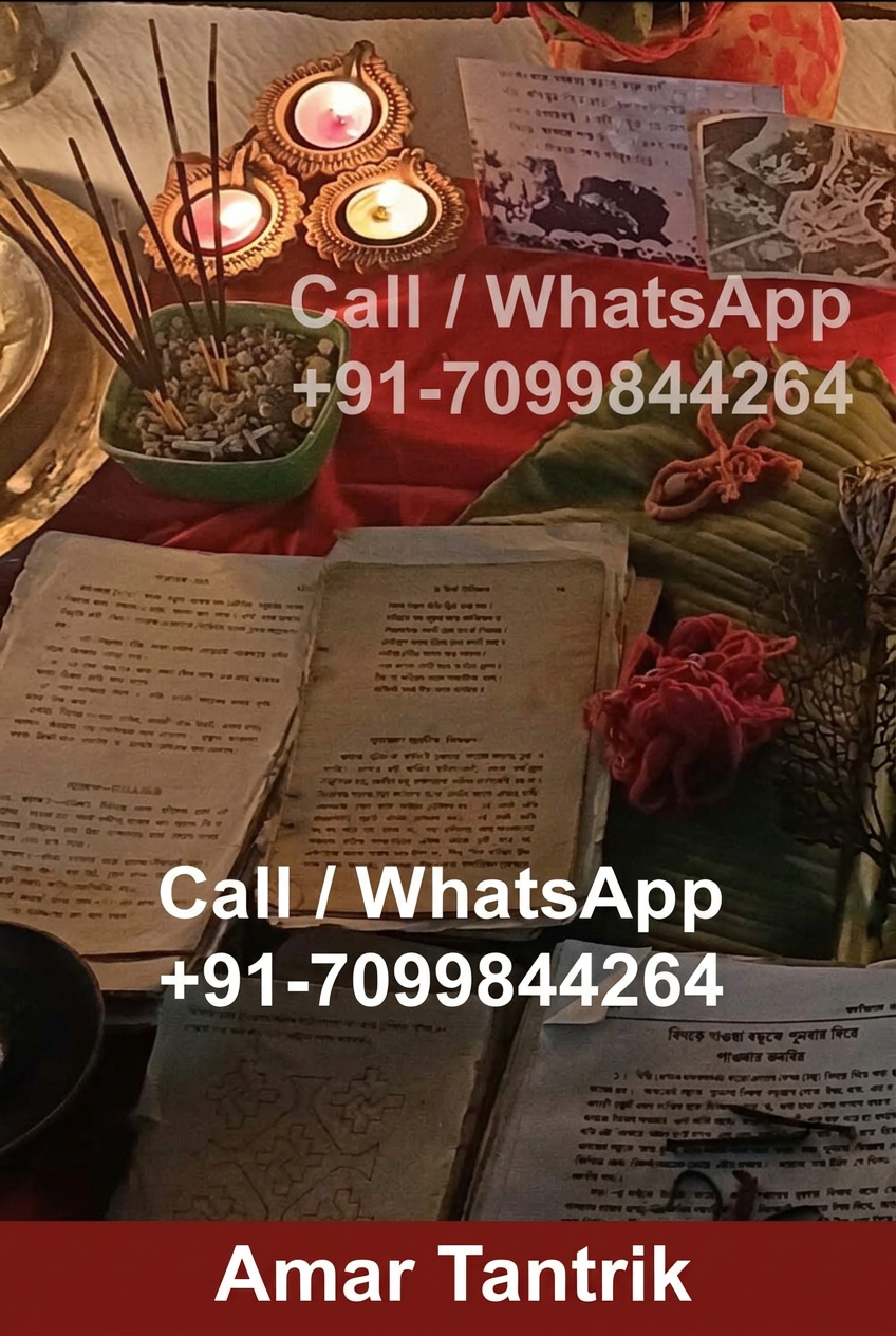 Manuscripts, incense and lit lamps arranged in the consultation space of Amar Tantrik